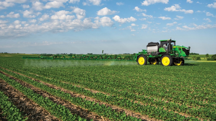 John Deere sprayer fertilizes a field of soybeans