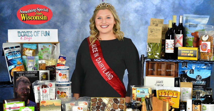 Taylor Schaefer with holiday gifts of wine, candy, popcorn etc. Taylor Schaefer with holiday gifts of wine, candy, popcorn etc.