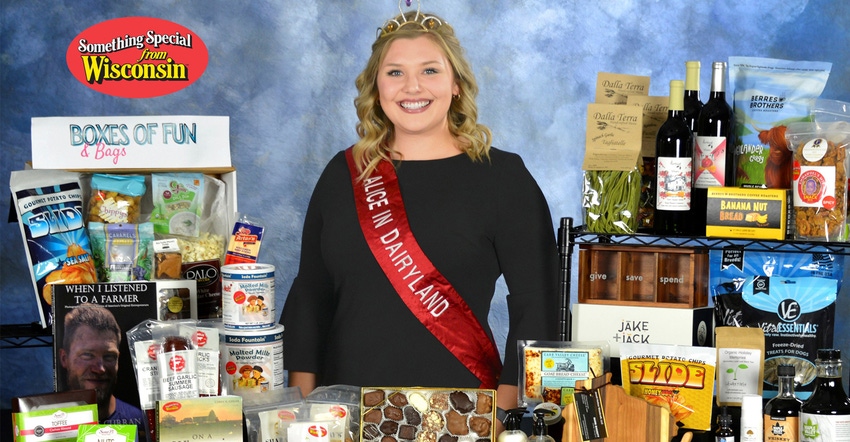 Taylor Schaefer with holiday gifts of wine, candy, popcorn etc.