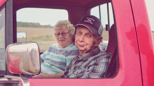  Grandpa Kenny and Grandma Erna sitting in a pickup truck