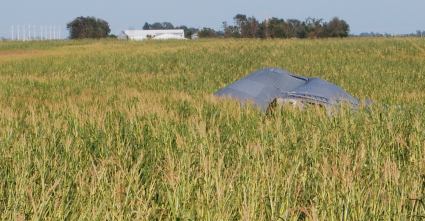 part of a farm structure sits in a field after Aug. 10 derecho