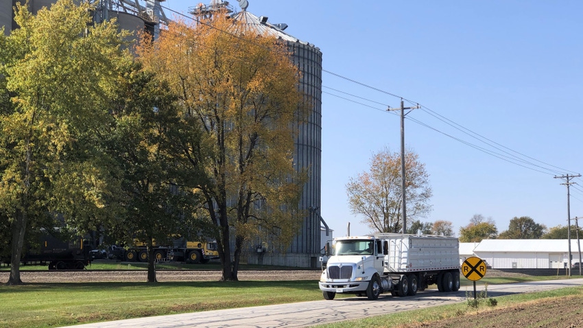 truck in front of grain elevator truck in front of grain elevator