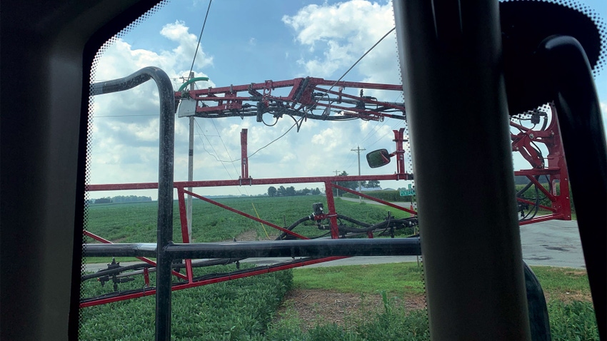 View of a field from the inside of a sprayer