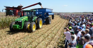 Combines and auger wagons at Farm Progress Show field demos