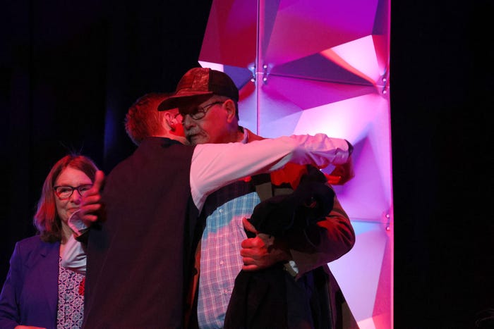 Wyatt Hendley hugs his grandfather Leon Pullum 