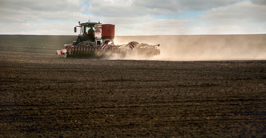 Tractor fertilizing field