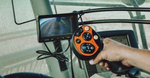 multifunctional hydro joystick controller in a combine cab