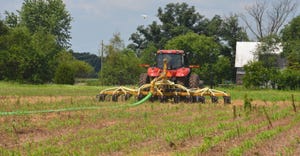 equipment injecting manure in field