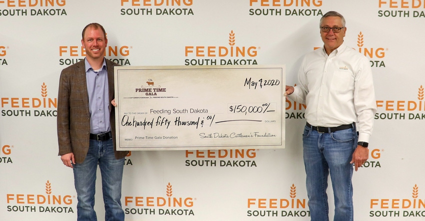 Ryan Eichler, president of the South Dakota Cattlemen’s Foundation, presenting Matt Gassen, CEO of Feeding South Dakota, wi