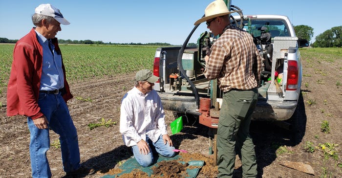 Mower SWCD's certified soil scientist Steve Lawler works with a crew to drill one of 60 wells at the Sustainable Answer Acre site to sample groundwater for nitrate levels
