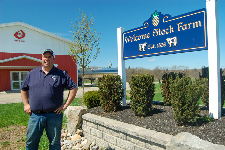 Neil Peck stands outside at his Welcome Stock Farm