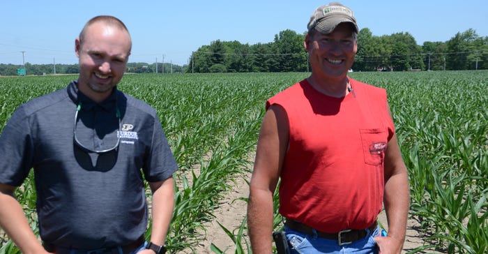 Dan Quinn and Pete Illingworth standing in cornfield