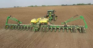 Large-scale machinery planting soybeans on a farm in Iowa – captured using a drone. 
