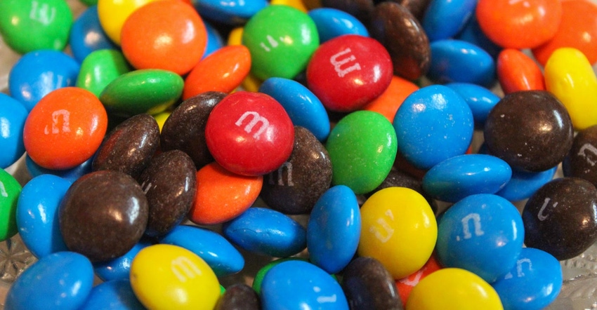 A close up of M&M candies of various colors in a dish