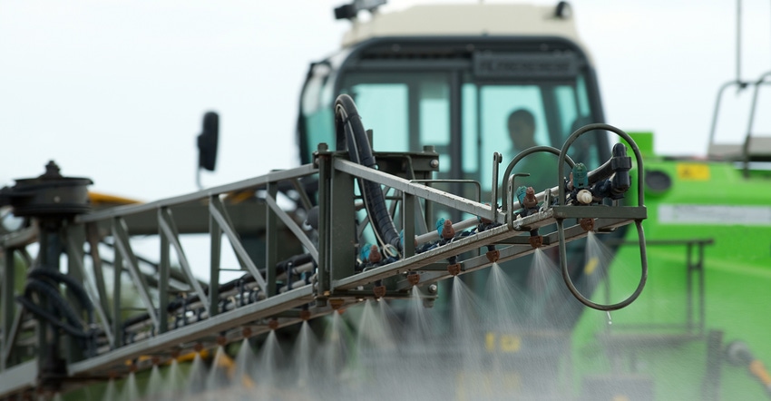 Green sprayer in a farm field Green sprayer in a farm field