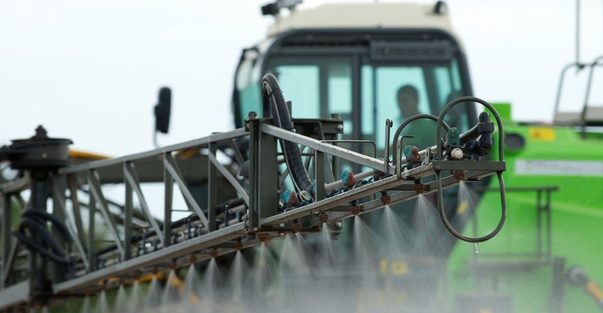 Green sprayer in a farm field