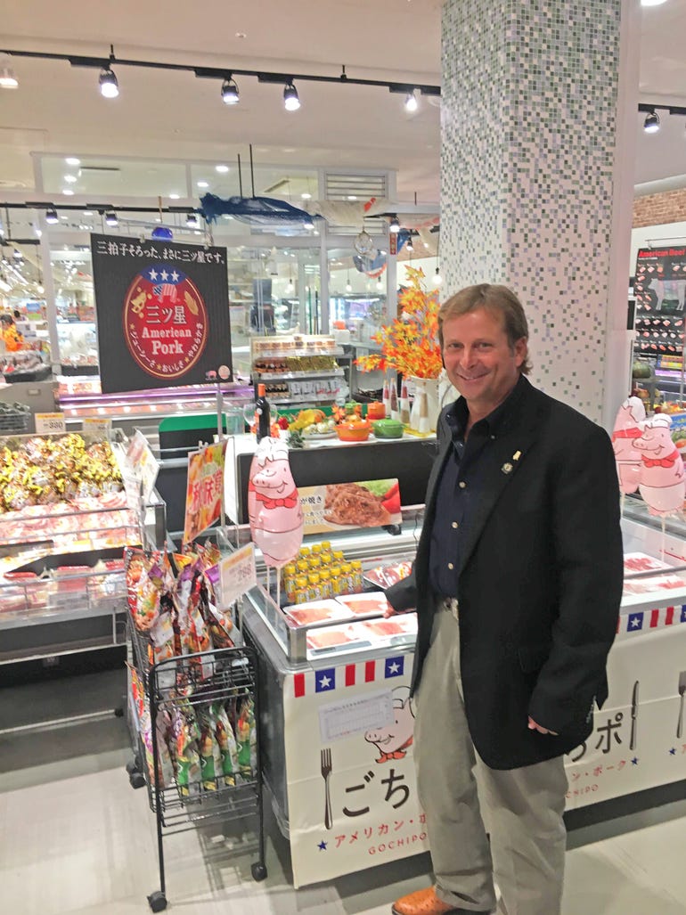 Jay Fischer peruses a meat display in a Japanese grocery store