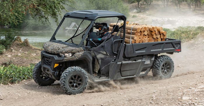 Can-Am  Defender Pro hauling logs in its six-foot bed
