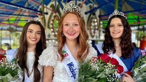 Maria Ivezaj, Kassie Acker and Kylie Spiekerman wearing tiaras on their heads as they smile for a photograph