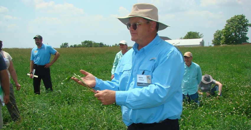 Keith Johnson out in a pasture