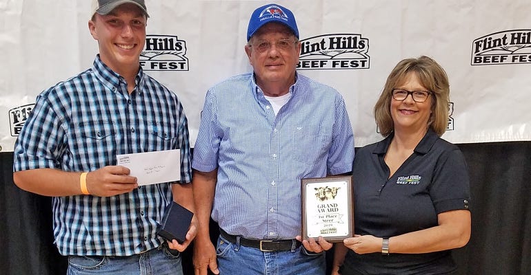 G&J Meats oFarm & Ranch of LeRoy won the steer division of the live stocker show at the Flint Hills Beef Fest as well as the Grand Award  for the live stocker show. Shown here are G Parker Meats, left, and Gary Meats with Beef Fest President Elect Jeanett