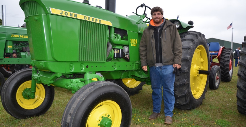 Andy Rayl with his family's 1965 John Deere 3020 Diesel tractor