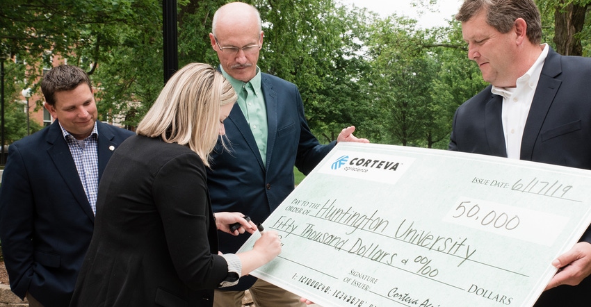 Nate Perry, Raymie Porter, Doug Rice and Jeanne Tuttle with big check