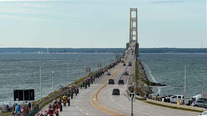 Generations unite on antique tractors to cross Mighty Mac