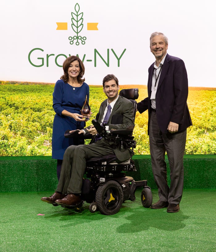 Adam Fine and Mike Winch of Dropcopter receive a Grow-NY award from Kathy Hochul, lieutenant governor of New York