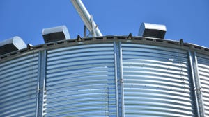 grain bin against blue sky