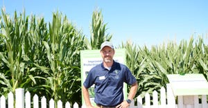 Man standing in front of corn field
