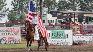  Women on horse carrying an american flag