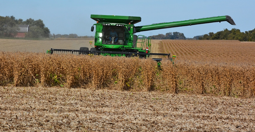 John Deere combine harvesting beans