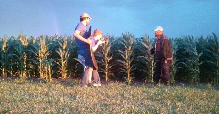 Todd Stevens (right in photo) raps to Royal Soil as he disappears through the sunset into the corn, similar to the ending of 