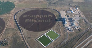 Aerial picutre of a farm with "support ethanol" super imposed over it.