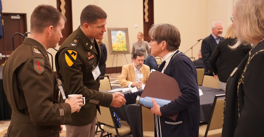Col. Timothy P. Hudson, commander of the U.S. Army Corps of Engineers, Tulsa District, talking with Kansas Governor Laura Kel Col. Timothy P. Hudson, commander of the U.S. Army Corps of Engineers, Tulsa District, talking with Kansas Governor Laura Kel