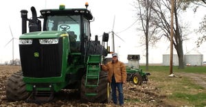 Marshall Martin standing by tractor