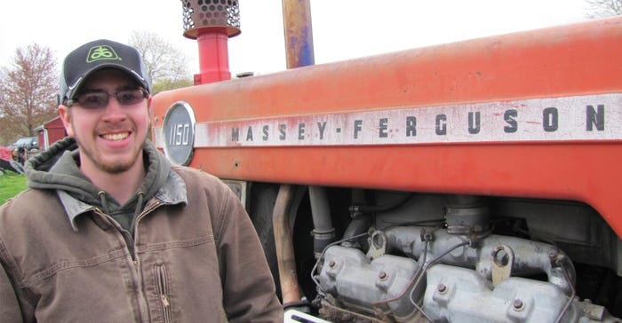 Tyler Henderson, 22 with antique Massey-Ferguson tractor