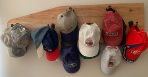 hat collection hanging on hat rack