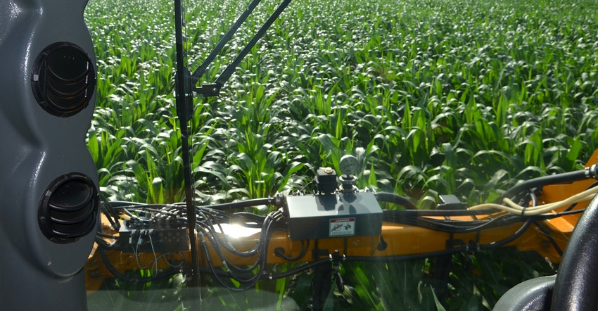 view from cab of injecting liquid N in corn at the V10 to V12 stage view from cab of injecting liquid N in corn at the V10 to V12 stage