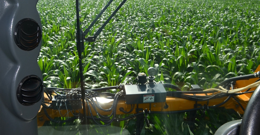 view from cab of injecting liquid N in corn at the V10 to V12 stage