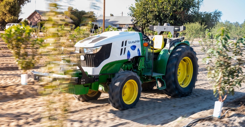 Tractor with Blue White Robotics system under the hood Tractor with Blue White Robotics system under the hood