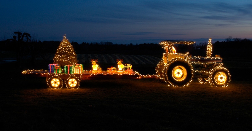 Tractor and trailer lit with Christmas lights