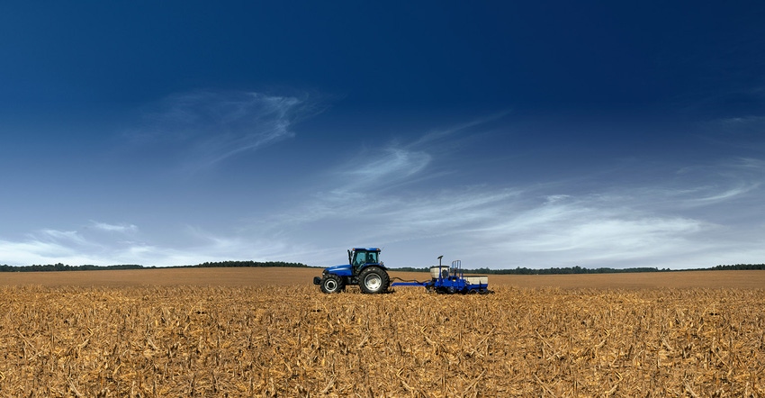 planting soybeans with blue tractor planting soybeans with blue tractor