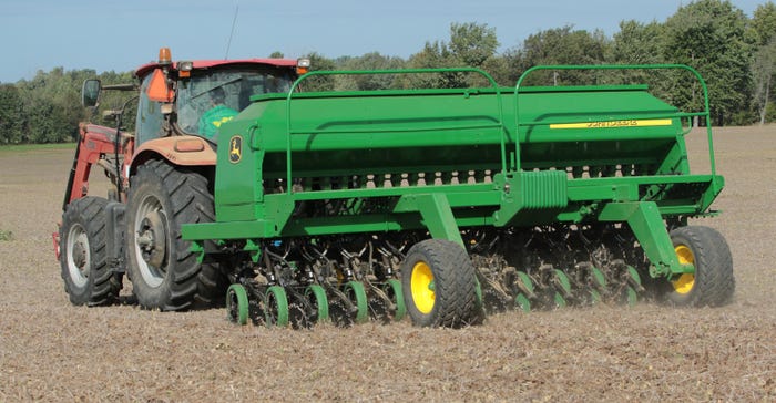 Case IH tractor pulling John Deere wheat drill