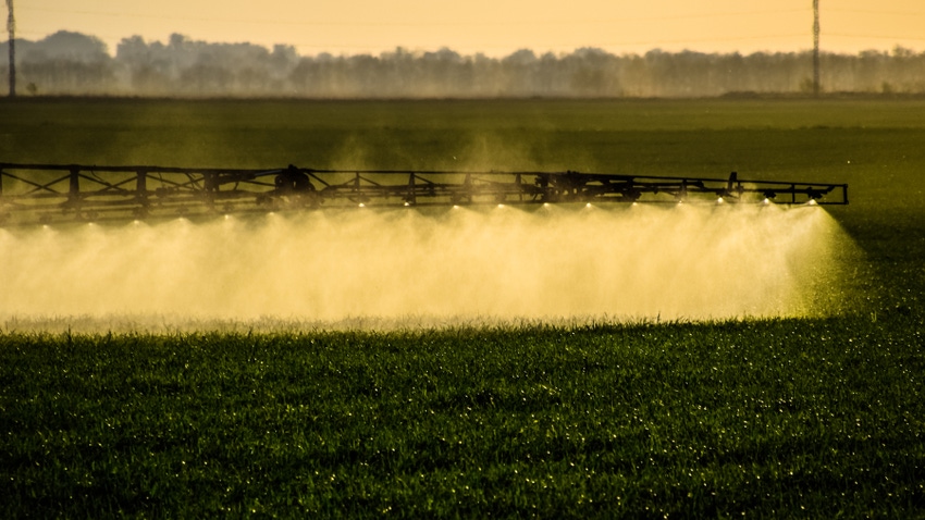 Jets of liquid fertilizer from the tractor sprayer Jets of liquid fertilizer from the tractor sprayer