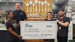 Nick Seger, president of the Ohio Pork Council, presenting a check to Courtney Schmidtke, Tiffine Carrington and Alex Zappone of SAME Café