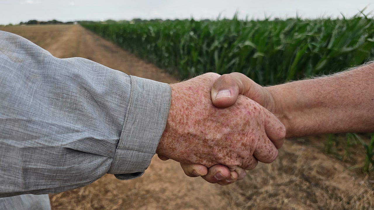 swfp-shelley-huguley-handshake-closeup.jpg