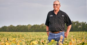 Ralph Lott standing in soybean field