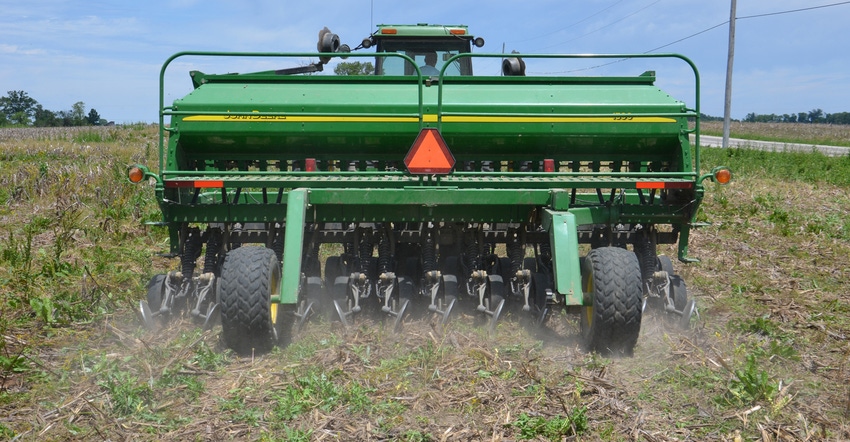 view of John Deere implement in field from behind